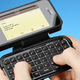Image for article titled This iPhone Case Packs a QWERTYriffic Flip-Out Keyboard